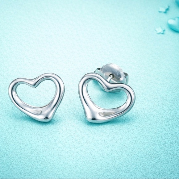 Tiffany & Co. Elsa Peretti Open Heart Stud Earrings in sterling silver.